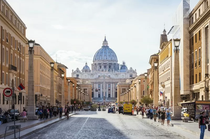 Pedestrians Near Rome's Dome Building