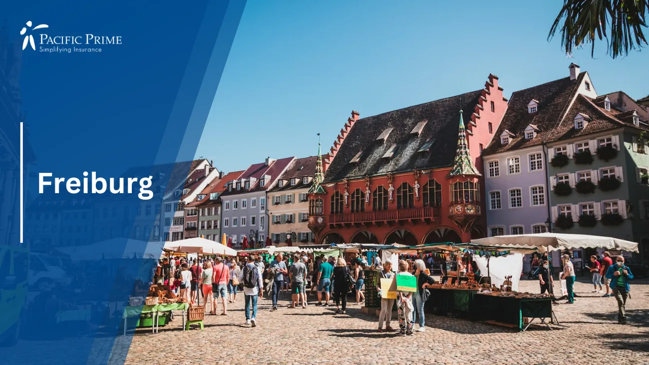 Image of People Gathered Around A Market In Freiburg, Germany with text overlay of "Freiburg"
