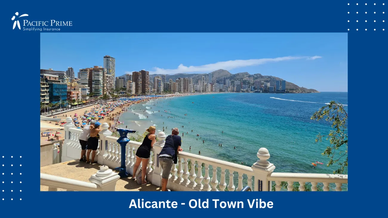 Image of People On A Bridge Over Water At Benidorm Beach, Alicante with text overlay of "Alicante - Old Town Vibe"