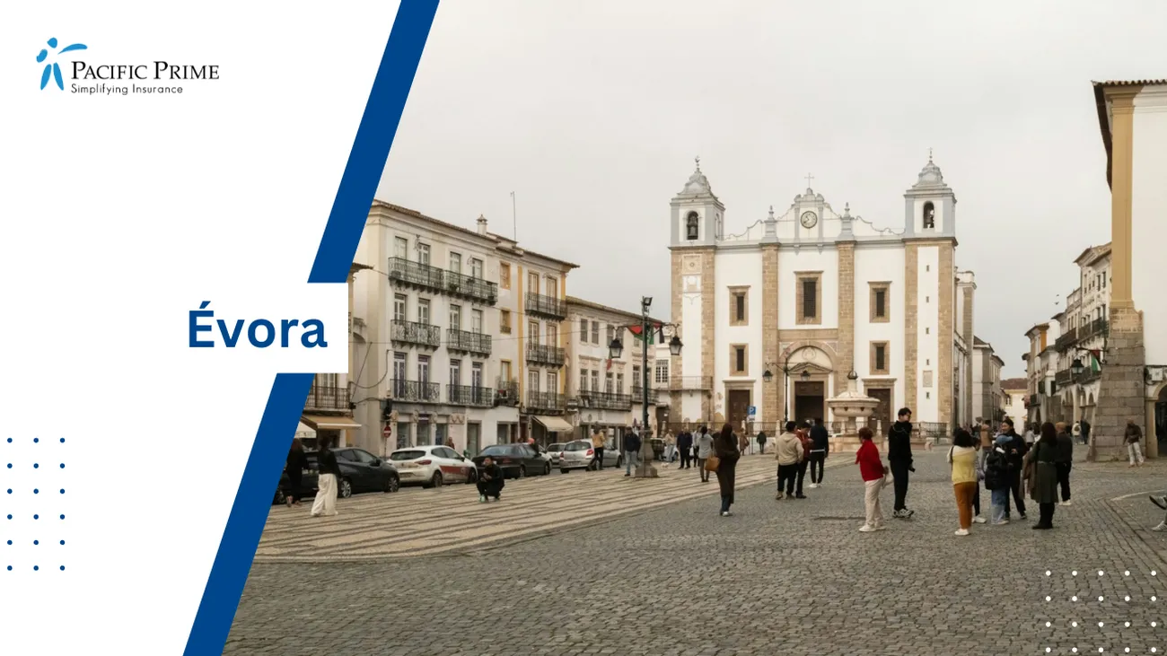 Image of People On Cobblestone Street At Praça Do Giraldo In Évora, Portugal with text overlay of "Évora"