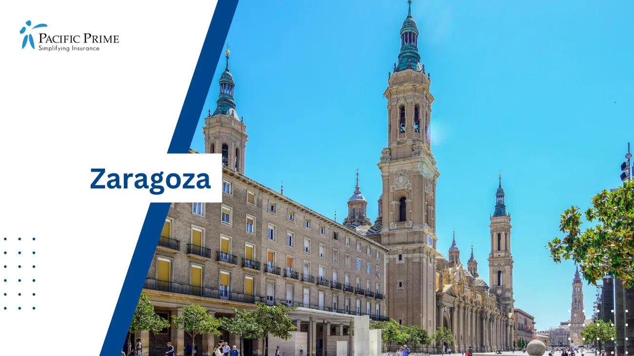 Image of People Walking By A Concrete Building In Zaragoza, Spain with text overlay of "Zaragoza"