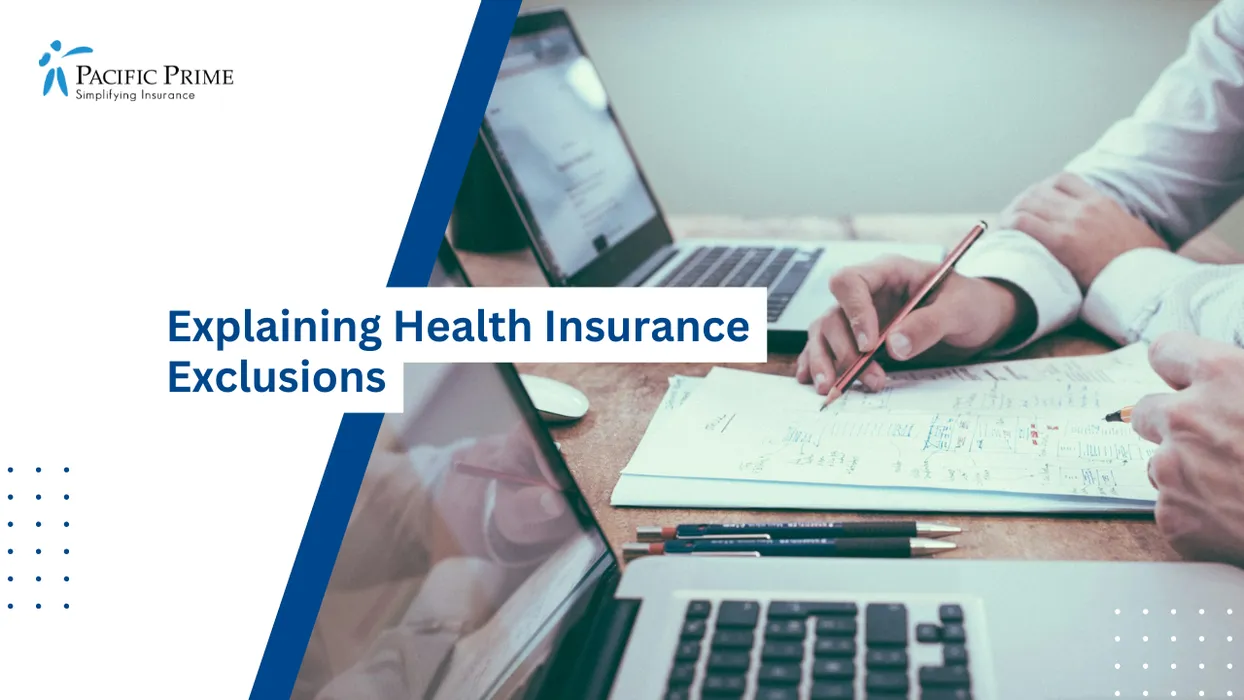 Image of Person Reviewing Insurance Notes With Pencil Beside A Laptop Workspace with text overlay of "Explaining Health Insurance Exclusions"