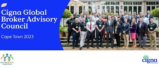 corporate group picture standing on steps in front of building