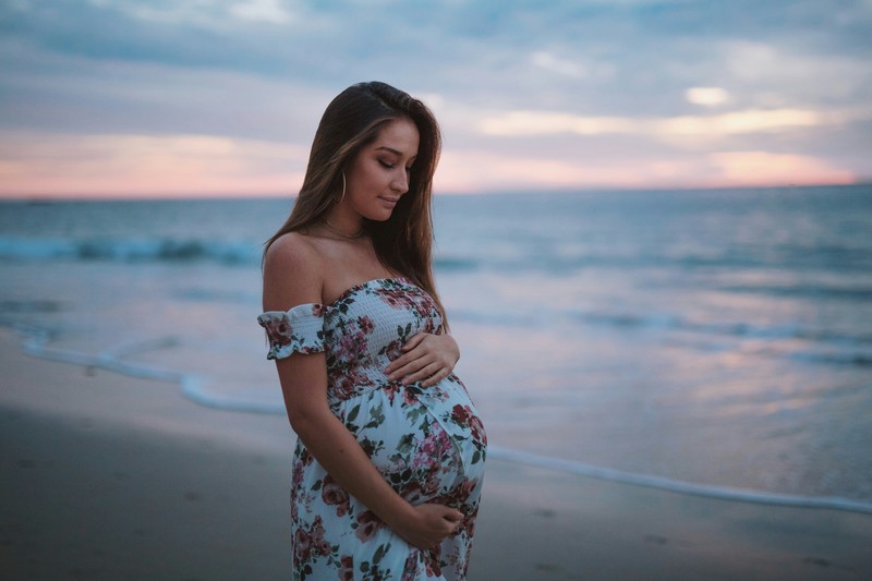 Pregnant Woman By The Seashore