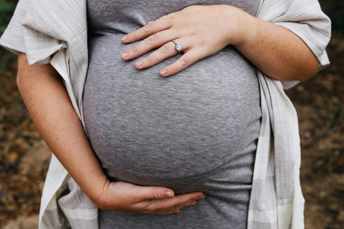 Pregnant Woman Cradling Her Belly