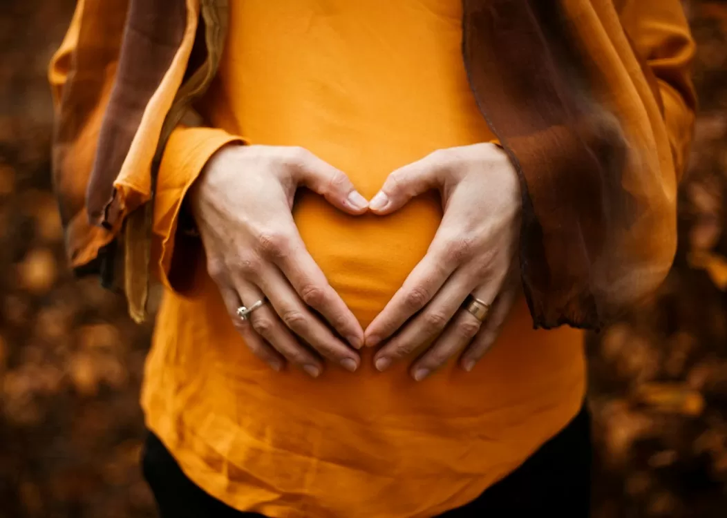Pregnant Woman Holding Her Stomach