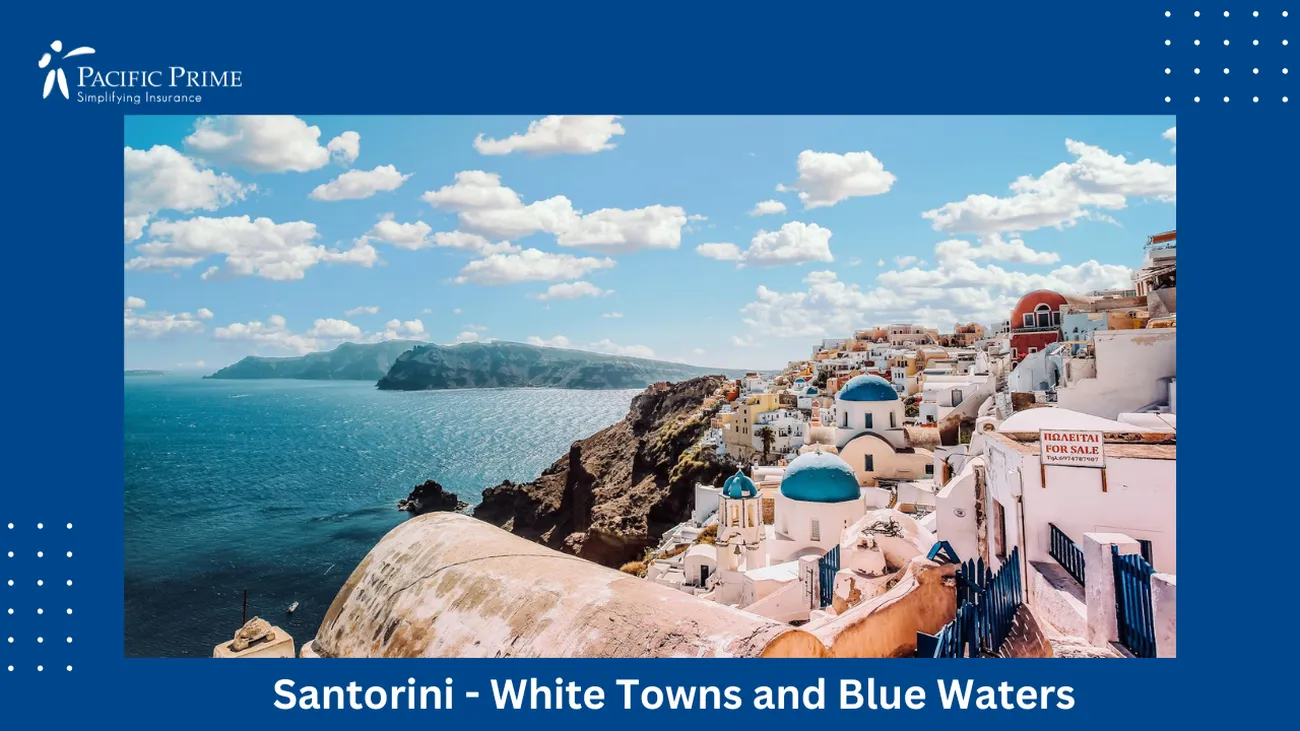 Image of Santorini White Concrete House By Water Under A Cloudy Blue Sky with text overlay of "Santorini - White Towns and Blue Waters"