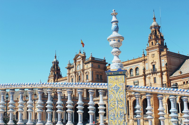 Seville's Plaza De España: Ornate Architecture Under Blue Sky