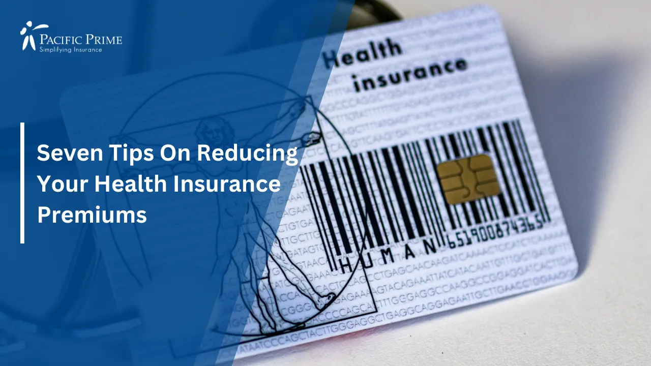 Image of Stethoscope Placed Beside A Health Card with text overlay of "Seven Tips On Reducing Your Health Insurance Premiums"