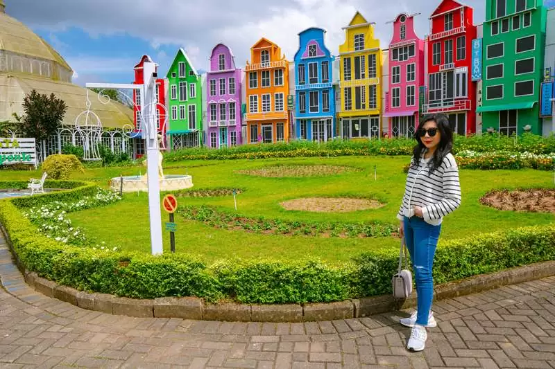 Stylish Asian Woman At Colorful House: Batu City, Indonesia
