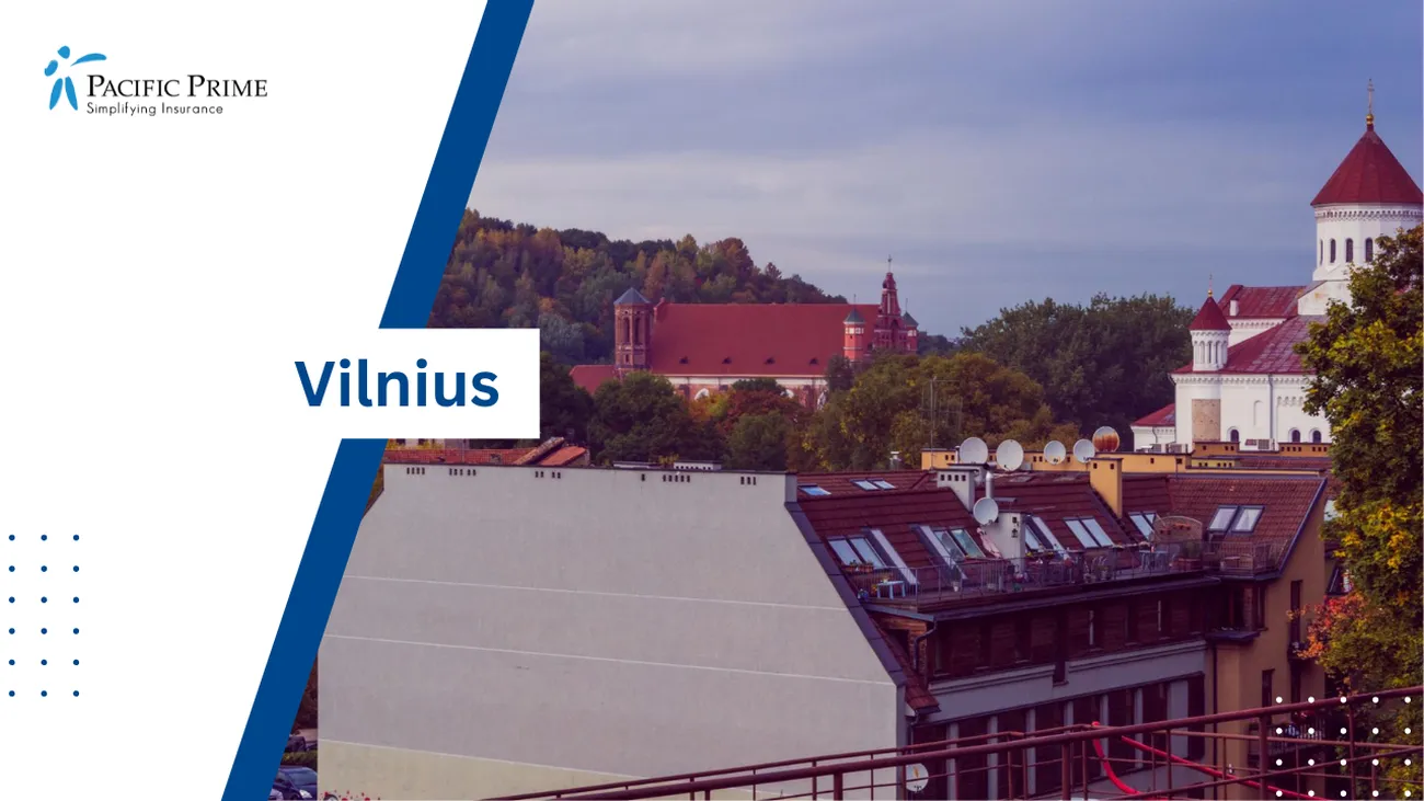 Image of Sunset: White & Brown Building Among Green Trees In Vilnius with text overlay of "Vilnius"