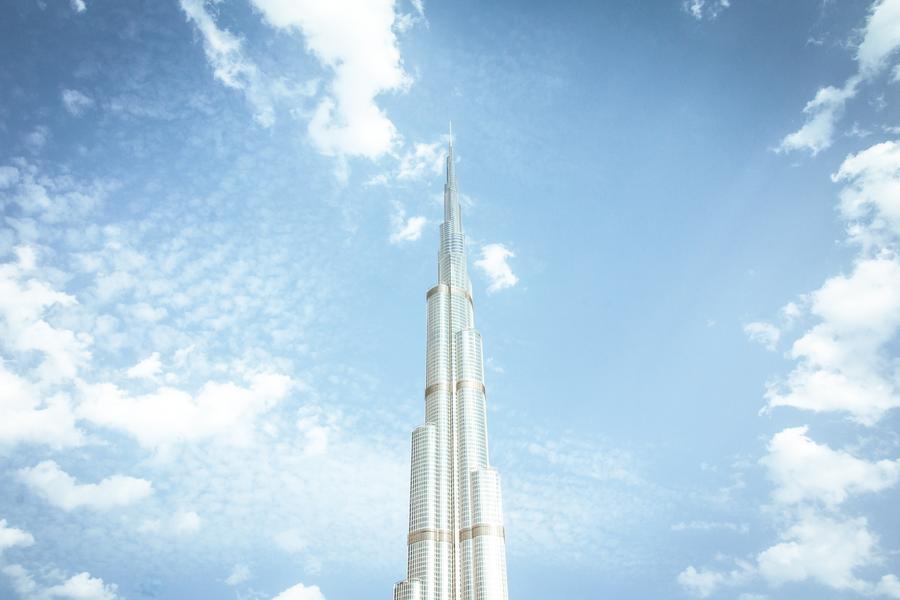 Tall White Building Against Dubai Sky - Living Quality In Dubai