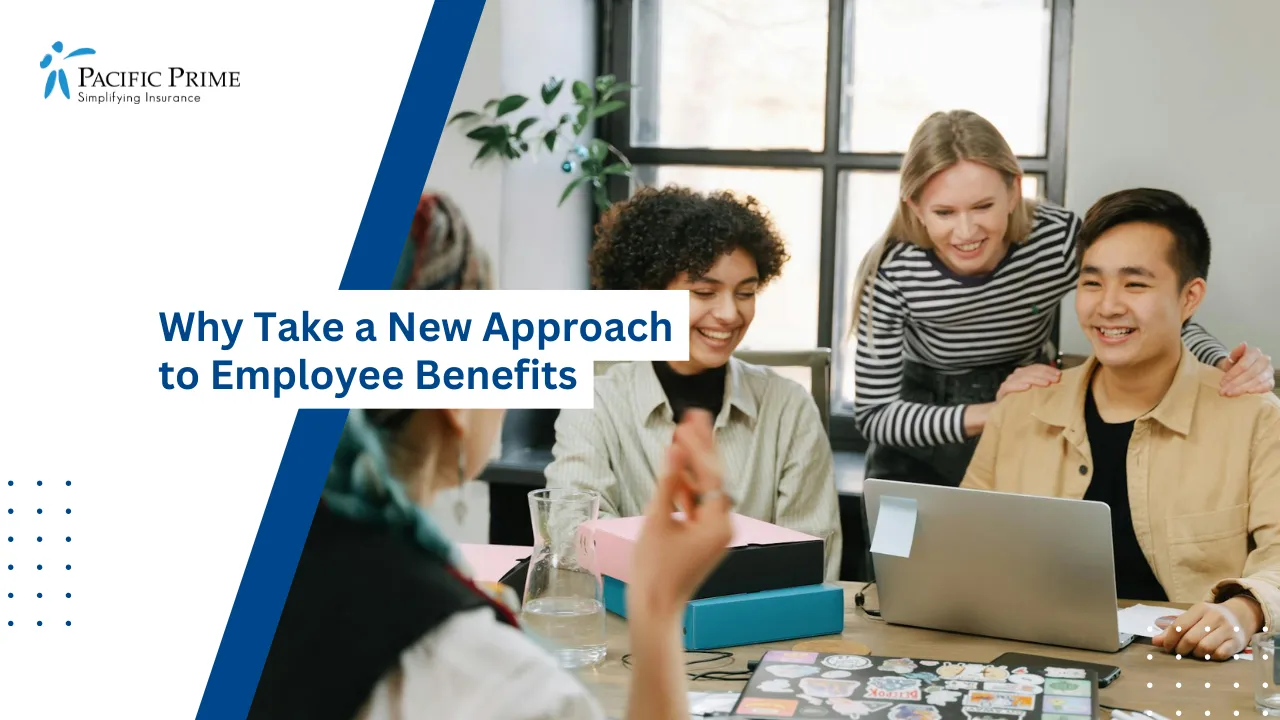 Image of Team Of Professionals Working Together In Office Space with text overlay of "Why Take a New Approach to Employee Benefits"