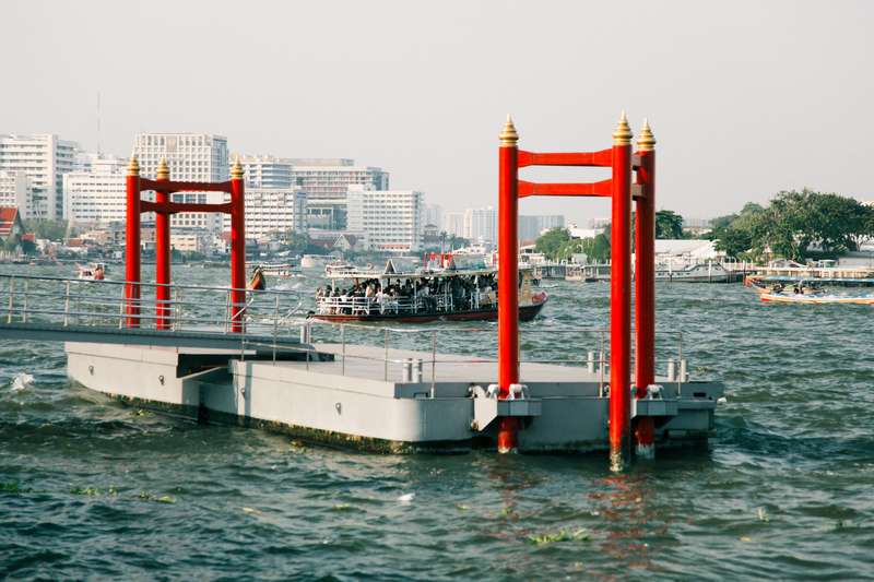 Thailand: Red And White Metal Post By Water