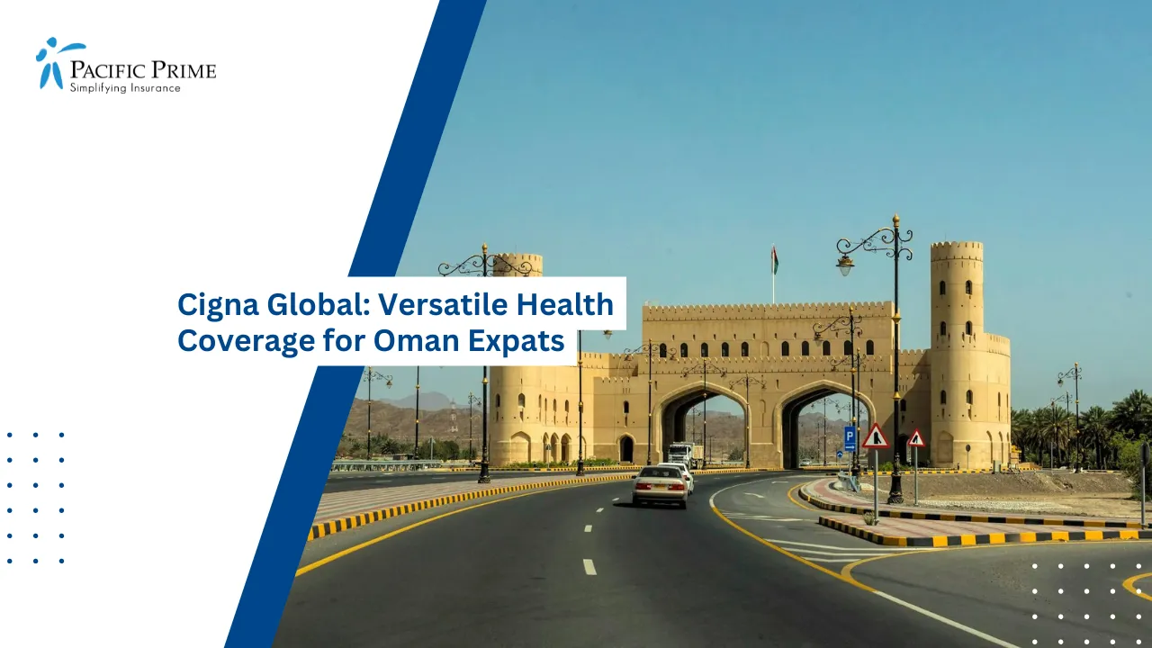 Image of Traditional Omani Gateway Beside A Road Under Clear Blue Skies with text overlay of "Cigna Global: Versatile Health Coverage for Oman Expats"