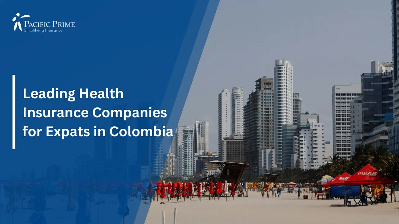 Image of Umbrella-filled Beach With City Buildings In Cartagena, Colombia with text overlay of "Leading Health Insurance Companies for Expats in Colombia"