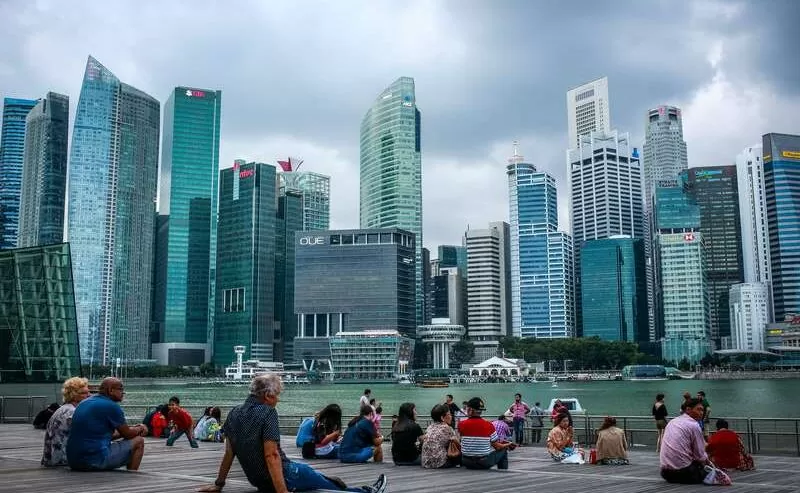 Urban Dwellers Gathered Near Skyscrapers In Daytime