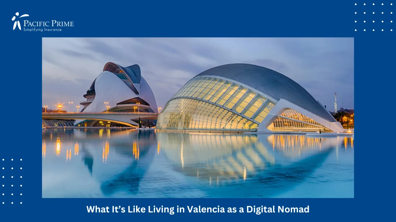 Image of Valencia City Lights Reflecting On The Sea At Night with text overlay of "What It’s Like Living in Valencia as a Digital Nomad"