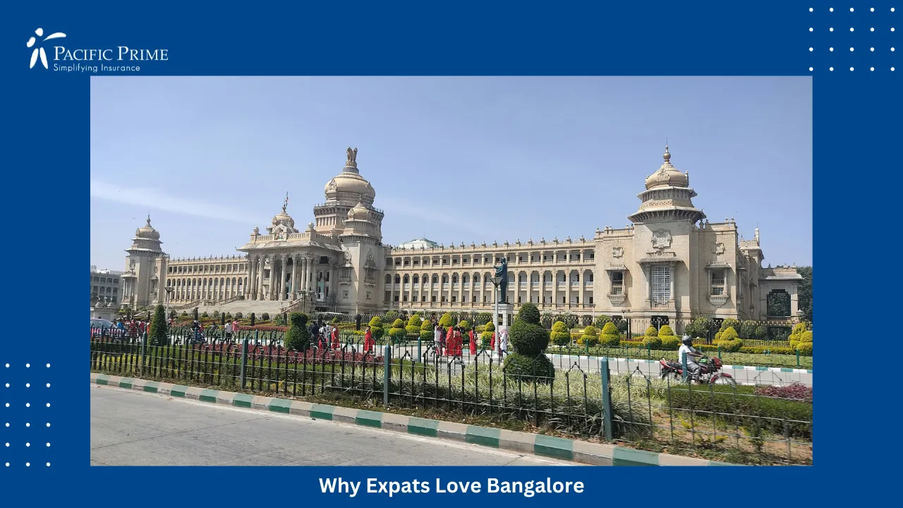Image of Vidhana Soudha In Bengaluru With Its Grand Facade And Surrounding Fence with text overlay of "Why Expats Love Bangalore"