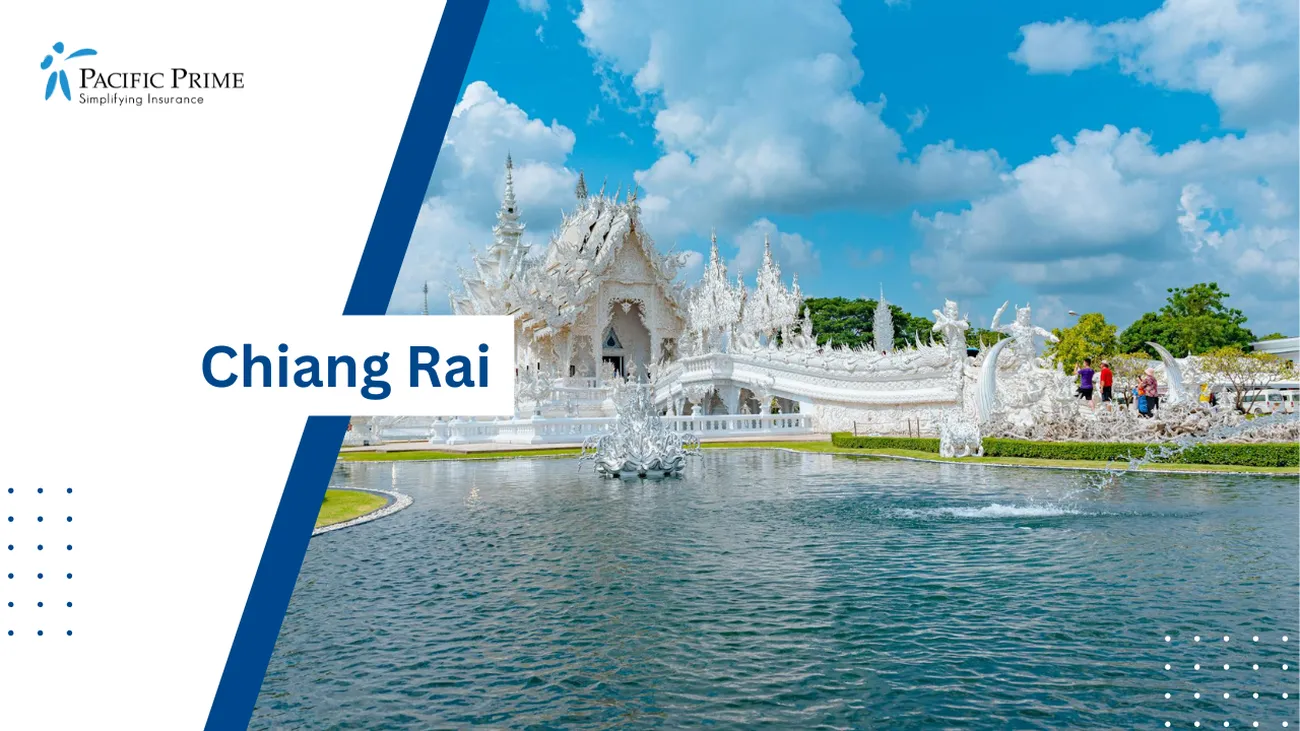 Image of White Buddhist Temple Nestled By A River In Chiang Rai, Thailand with text overlay of "Chiang Rai"
