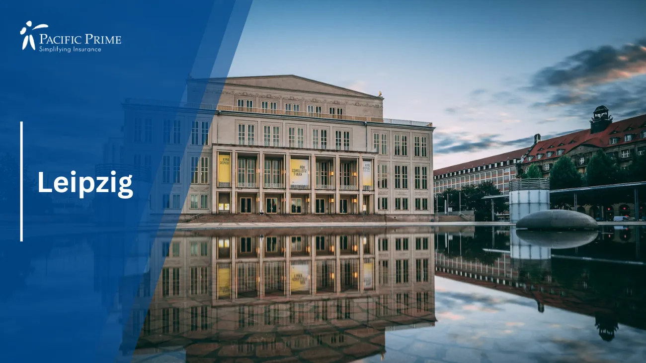 Image of White Concrete Building By Water At Night In Leipzig, Germany with text overlay of "Leipzig"