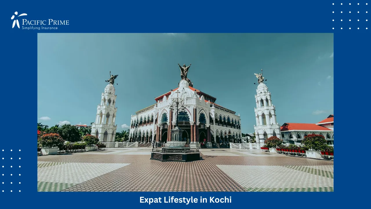 Image of White Landmark Building In Edapally, Kochi With Statues Along The Rooftop with text overlay of "Expat Lifestyle in Kochi"
