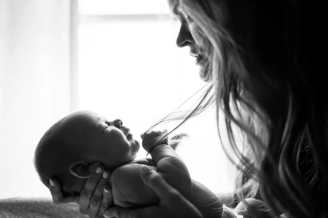 Woman Cradling Baby