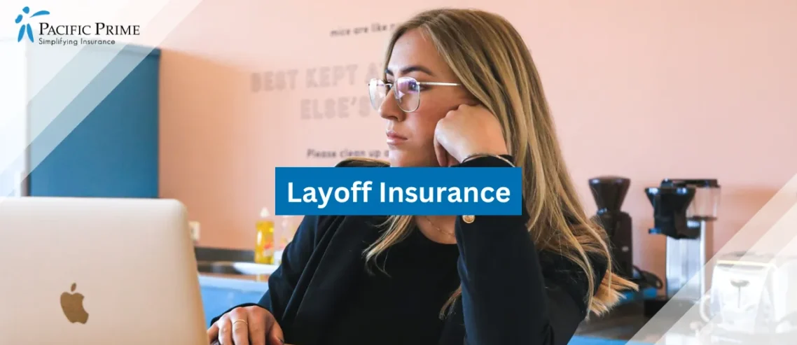 Image of Woman In Black Top And Glasses Working On Macbook Laptop Indoors with text overlay of "Layoff Insurance"