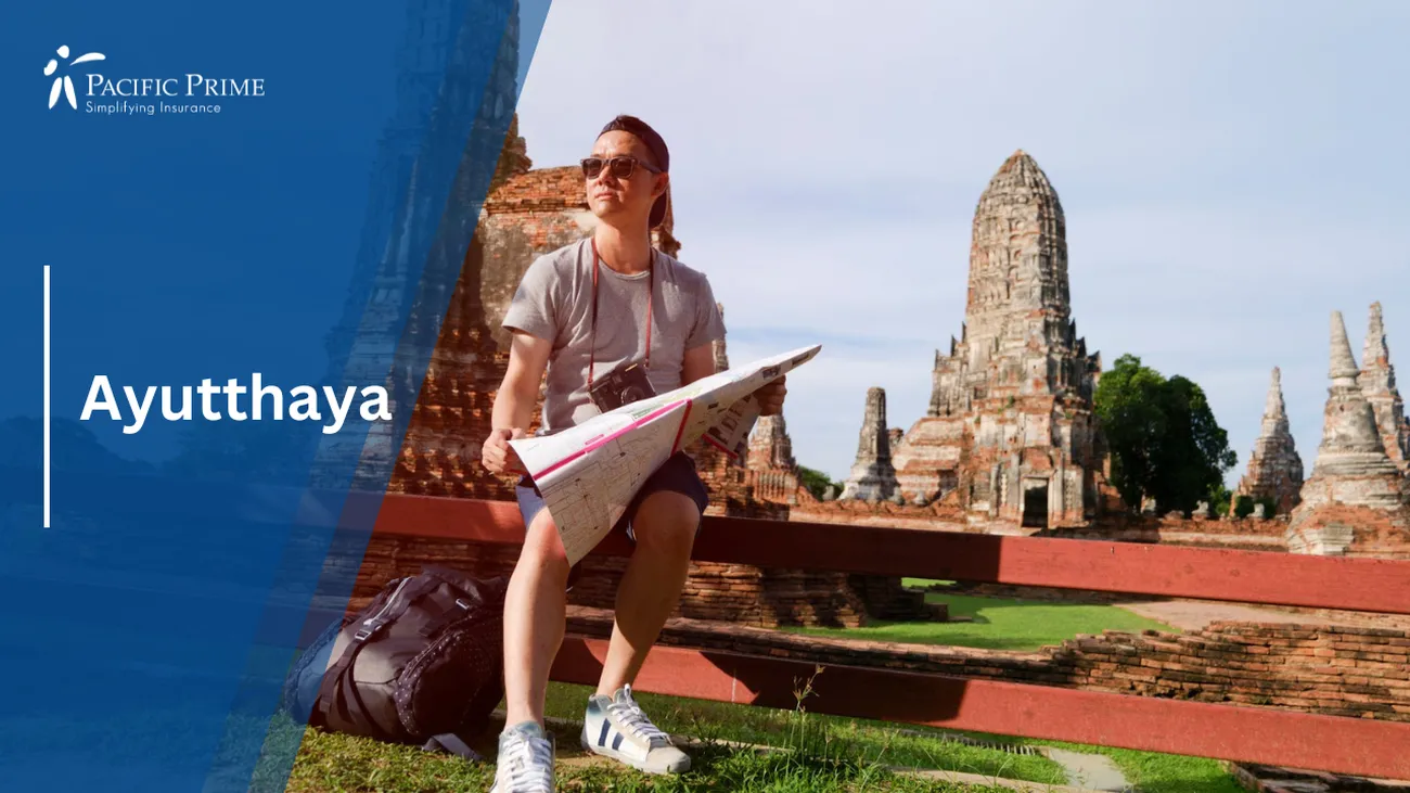 Image of Woman On Red Fence Holding Paper In Historic Ayutthaya, Thailand with text overlay of "Ayutthaya"