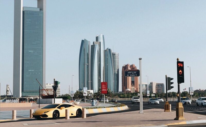 Yellow Car In Abu Dhabi, Showcasing Daytime City Life For Residents